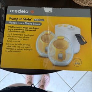 Medela Breast Pump with Yellow and White Accents